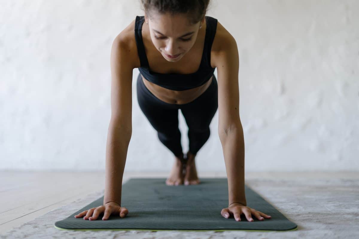 Afro American Sporty And Fit Woman Training At Home