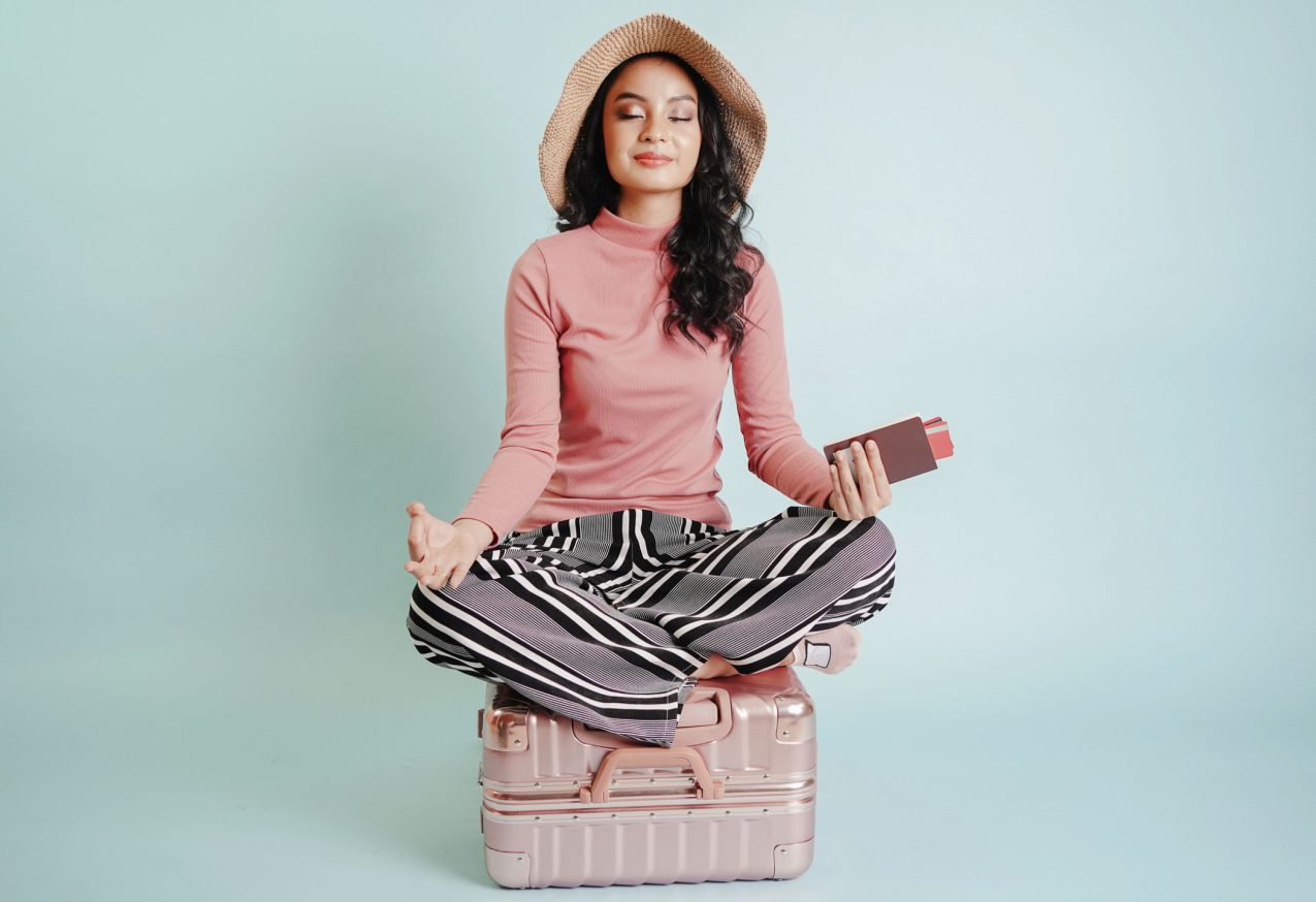 Woman Meditating Suitcase 1000x1440